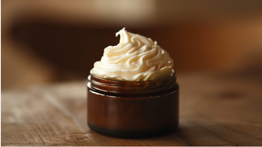 Coconut Vanilla Body Butter in a dark amber glass jar with a whipped, creamy texture. Ideal for moisturizing skin with a tropical coconut vanilla scent.